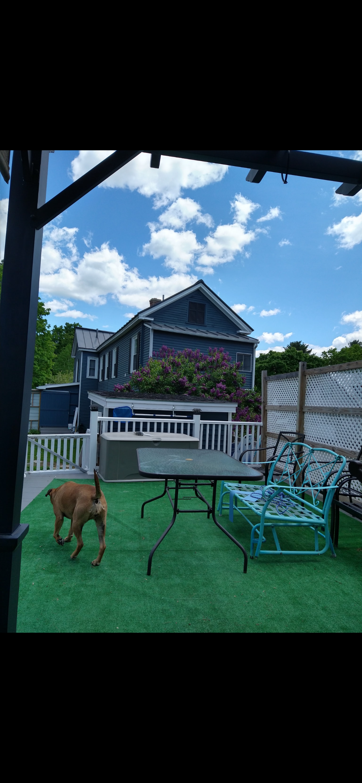Pet-friendly outdoor seating area with table and chairs - Skowhegan contractor housing